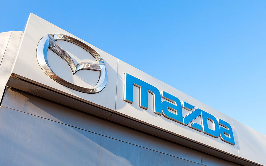 Mazda brand logo signage in blue