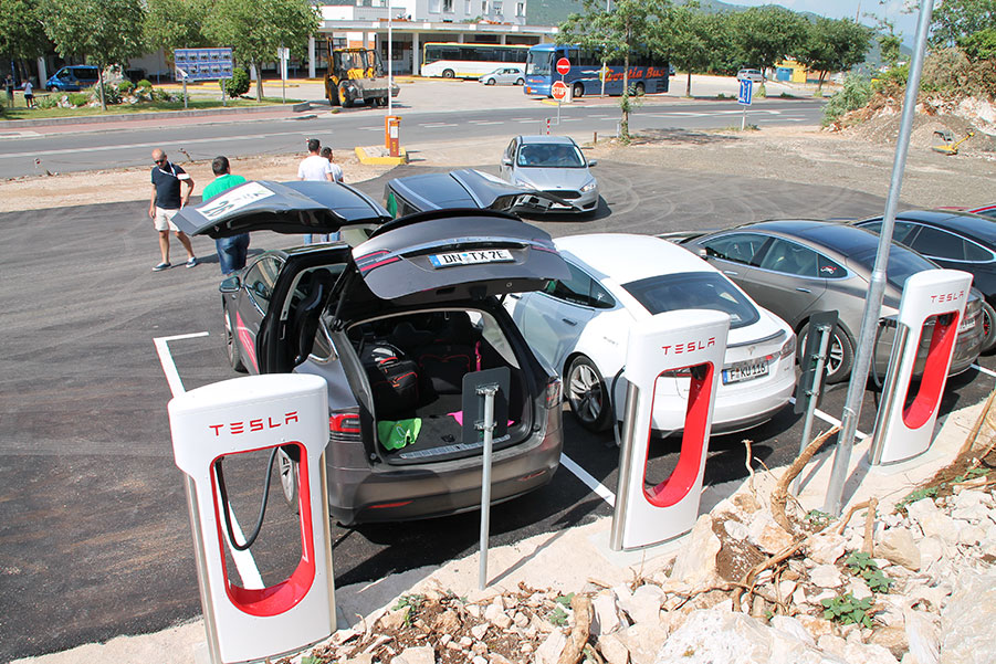 Tesla car truck at pit stop waiting for windshield repair service