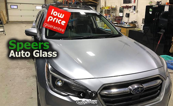 gun metal grey Subaru sedan needs front windshield replacement in Speers Oakville shop