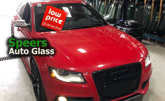 red Audi a5 sedan needs front windshield replacement in Speers Oakville shop