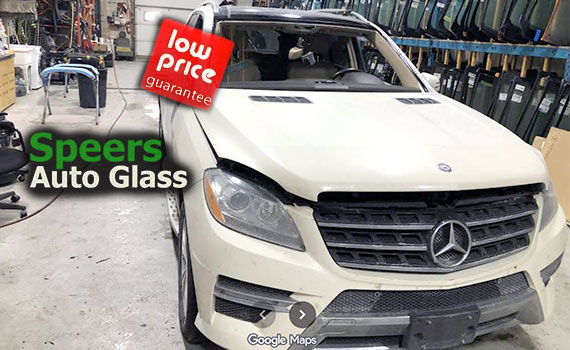 white Mercedes-Benz SUV needs front windshield replacement in Speers Oakville shop